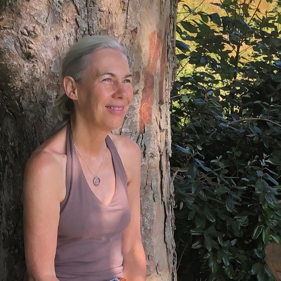 Carole Pearson leaning against a tree
